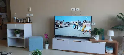 a flat screen tv sitting in a living room at 1 br stylish flat in phase 2 MH in Hurghada