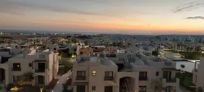 an aerial view of a city at sunset at 1 br stylish flat in phase 2 MH in Hurghada