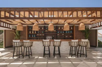 a rendering of a bar with bar stools at Iberotel Luxor in Luxor