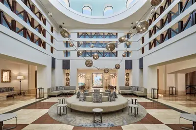 a lobby with a large couch in the middle at Sheraton Miramar Resort El Gouna in Hurghada