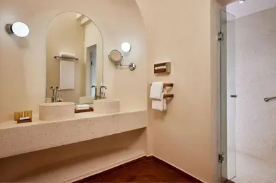 a bathroom with two sinks and a mirror at Sheraton Miramar Resort El Gouna in Hurghada
