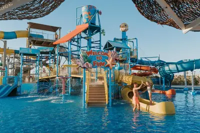a water park with two people on a water slide at Sheraton Soma Bay Resort in Hurghada