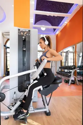 a woman on a treadmill in a gym at Three Corners Rihana Resort El Gouna in Hurghada