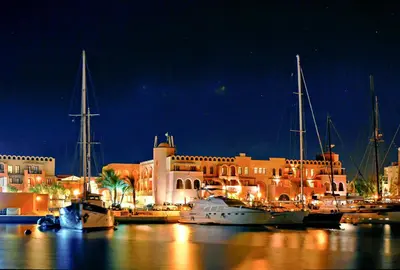 a group of boats docked in a marina at night at Three Corners Ocean View El Gouna - Adults Only in Hurghada