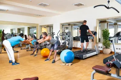 a group of people in a gym working out at Three Corners Fayrouz Plaza Beach Resort in Port Ghalib