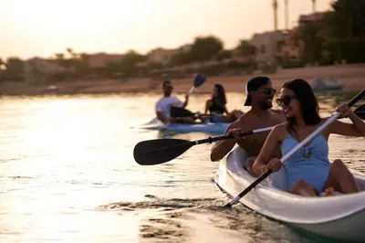 a group of people kayaking on the water at Steigenberger Golf Resort El Gouna in Hurghada