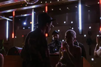 a group of people standing in a dark room at Cook’s Club El Gouna (Adults Only) in Hurghada