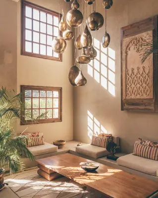 a living room with a table and some pots and pans at Cook’s Club El Gouna (Adults Only) in Hurghada