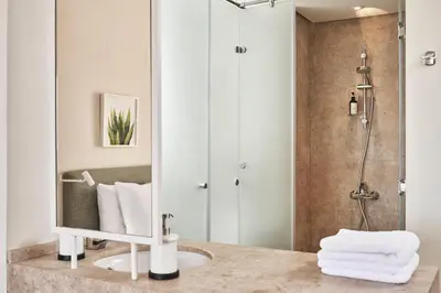 a bathroom with a sink and a shower at Captain's Inn Hotel in Hurghada