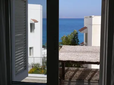 a view of the ocean from a window at Mini-Studio With Free Private Beach in Hurghada