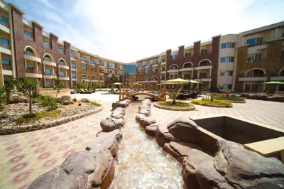 a water feature in a courtyard in a building at Royal Beach Serviced Apartments in Hurghada