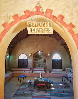 a large room with a sign that reads bloit house at Qasr El Bagawat Hotel in ‘Ezbet Halfa