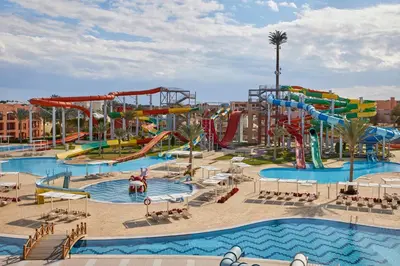 a large water park with a water slide and slides at JAZ Neo Dar El Madina in Coraya Bay