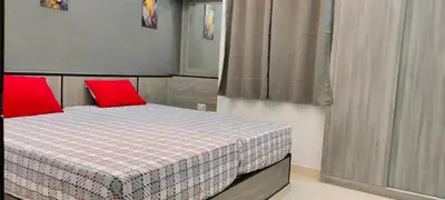 a small bedroom with a bed with red pillows at Hurghada Big private villa for families in Hurghada