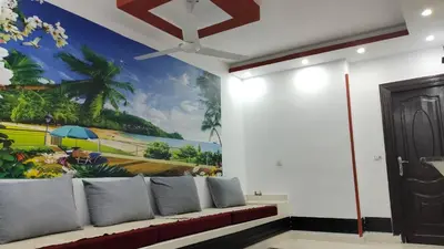 a living room with a couch with a painting on the wall at Hurghada Big private villa for families in Hurghada