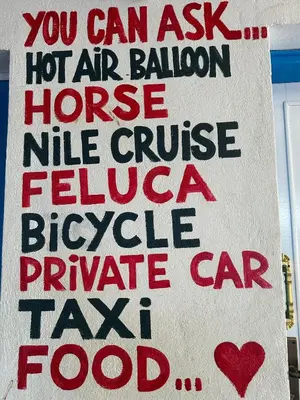 a sign that says you can ask hot air balloon house nurse nurse false cruise f at Al Salam Camp in Luxor