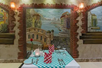 a mural of a room with a table in front of a painting at Gravity Hotel & Aqua Park Hurghada Families and Couples Only in Hurghada