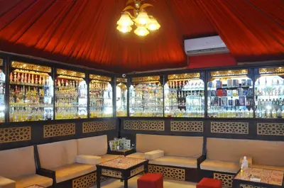a bar with lots of bottles of alcohol on the wall at Gravity Hotel & Aqua Park Hurghada Families and Couples Only in Hurghada