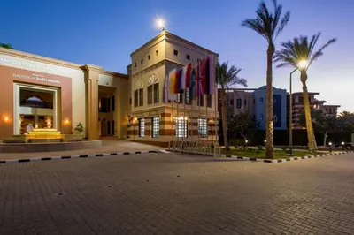a building with flags on the side of it at Marina Resort Port Ghalib, a member of Radisson Individuals in Port Ghalib