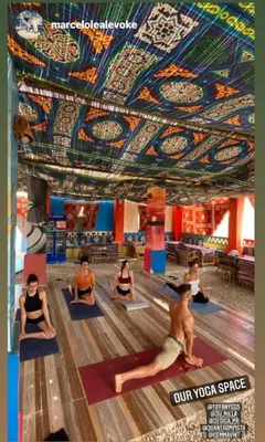 a group of people sitting in a yoga class at Nuba Narty in Aswan