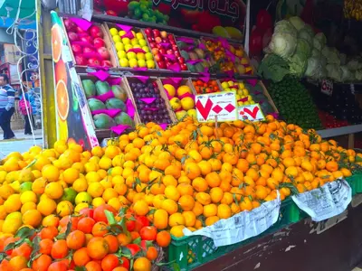 a display of oranges and other fruits in a market at Angie House Embassy area with wi fi in Hurghada