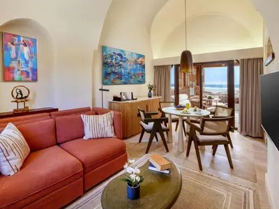a living room with a couch and a table at Movenpick Resort El Quseir in Quseir