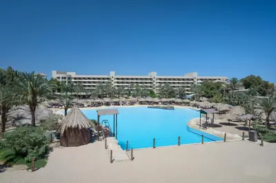 a large swimming pool in front of a resort at Sindbad Club in Hurghada