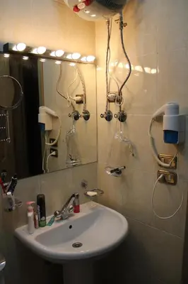 a bathroom with a sink and a mirror at Pool View Apartment at British Resort - Unit 02 in Hurghada