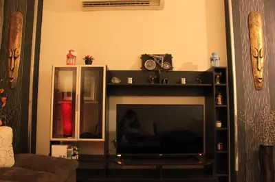 a flat screen tv in a living room at Pool View Apartment at British Resort - Unit 02 in Hurghada