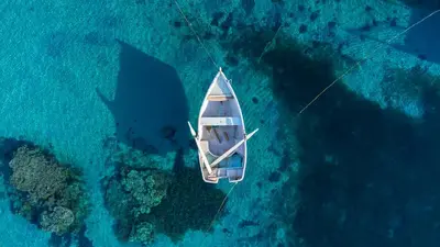 an aerial view of a boat in the ocean at Amwaj Beach Club Abu Soma in Hurghada