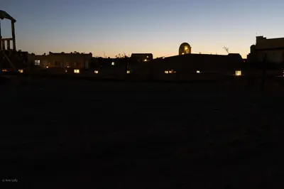 a silhouette of a city at sunset at Sharm El Naga Resort and Diving Center in Hurghada