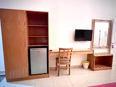a room with a desk with a computer and a chair at Masaya Hurghada in Hurghada