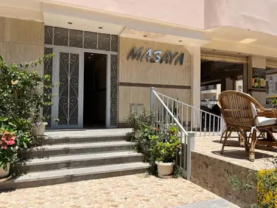a building with stairs in front of a store at Masaya Hurghada in Hurghada