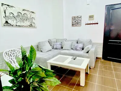 a living room with a couch and a coffee table at Zebra Apartments Hurghada center in Hurghada