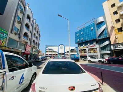 a white car parked on the side of a city street at Tamburine Chalet with Wi Fi Hurghada center in Hurghada