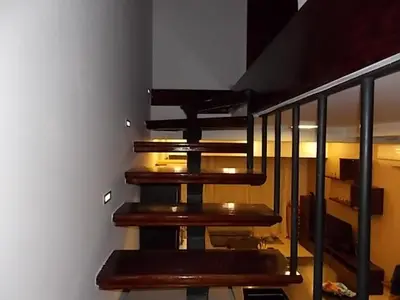 a set of wooden stairs in a room at Sea View Duplex Villa in Hurghada