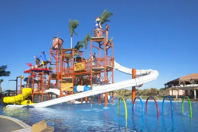 a water park with a water slide in the water at Pickalbatros Aqua Vista Resort - Hurghada in Hurghada
