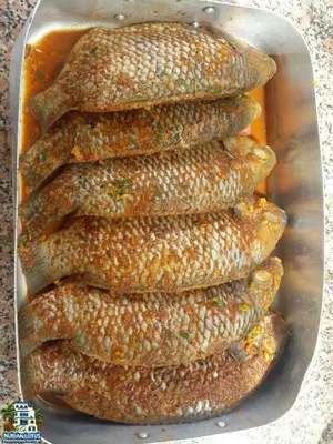 a pile of corn on the cob in a pan at Nubian Lotus in Aswan