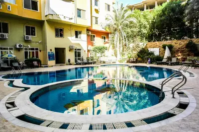 a swimming pool in the middle of a building at Diamond Arabia with Wi Fi in Hurghada