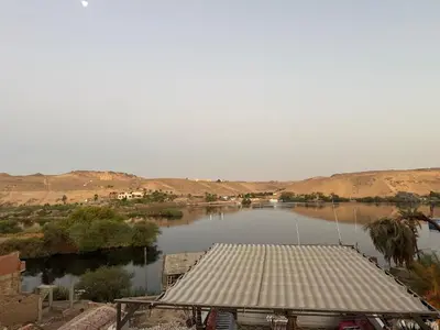 a view of a body of water with a building at Seko Kato Nile View Hostel in Aswan