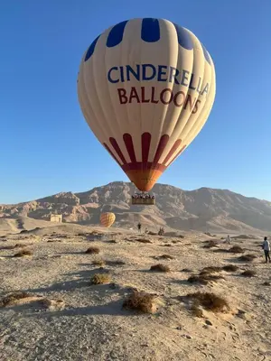 a hot air balloon flying over the desert at House of Dreams apartments Luxor in Luxor