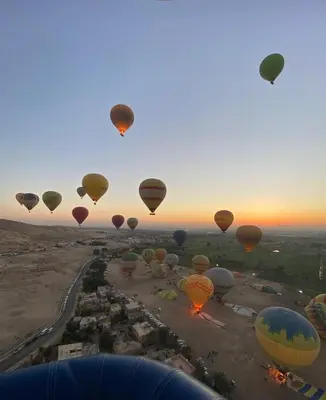 a bunch of hot air balloons in the sky at House of Dreams apartments Luxor in Luxor