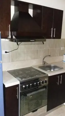 a kitchen with a stove and a sink at tiba resort hurghada A16 in Hurghada