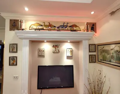 a television in a living room with a shelf on a wall at Villa Rayan in Hurghada