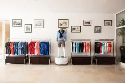 a store with four display racks of clothes at Steigenberger Makadi - Adults Friendly 16 Years Plus in Hurghada