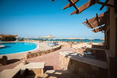 a view of the beach and the pool at a resort at Silver Beach Boutique Hotel in Quseir