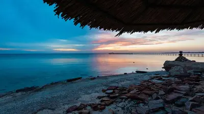 a view of the beach at sunset at Silver Beach Boutique Hotel in Quseir
