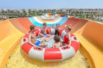 a group of people sitting in an inflatable raft in the water at JAZ Makadi Saraya Resort in Hurghada