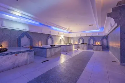 a large room with blue lights on the walls at Shams Prestige Abu Soma (Adults Only) in Hurghada