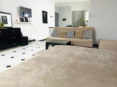 a living room with a bed and a couch at Lima Modern Sheraton with Wi Fi in Hurghada